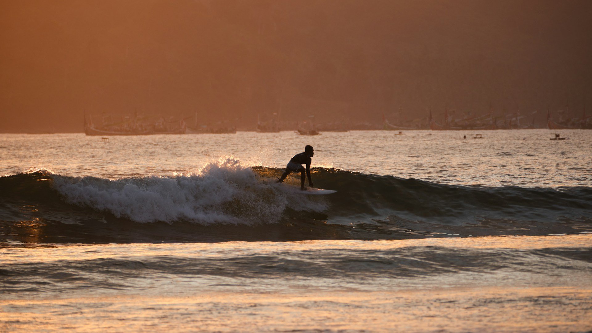 Surfing a perfect Indonesian barrel. Photo: Joshua Kettle